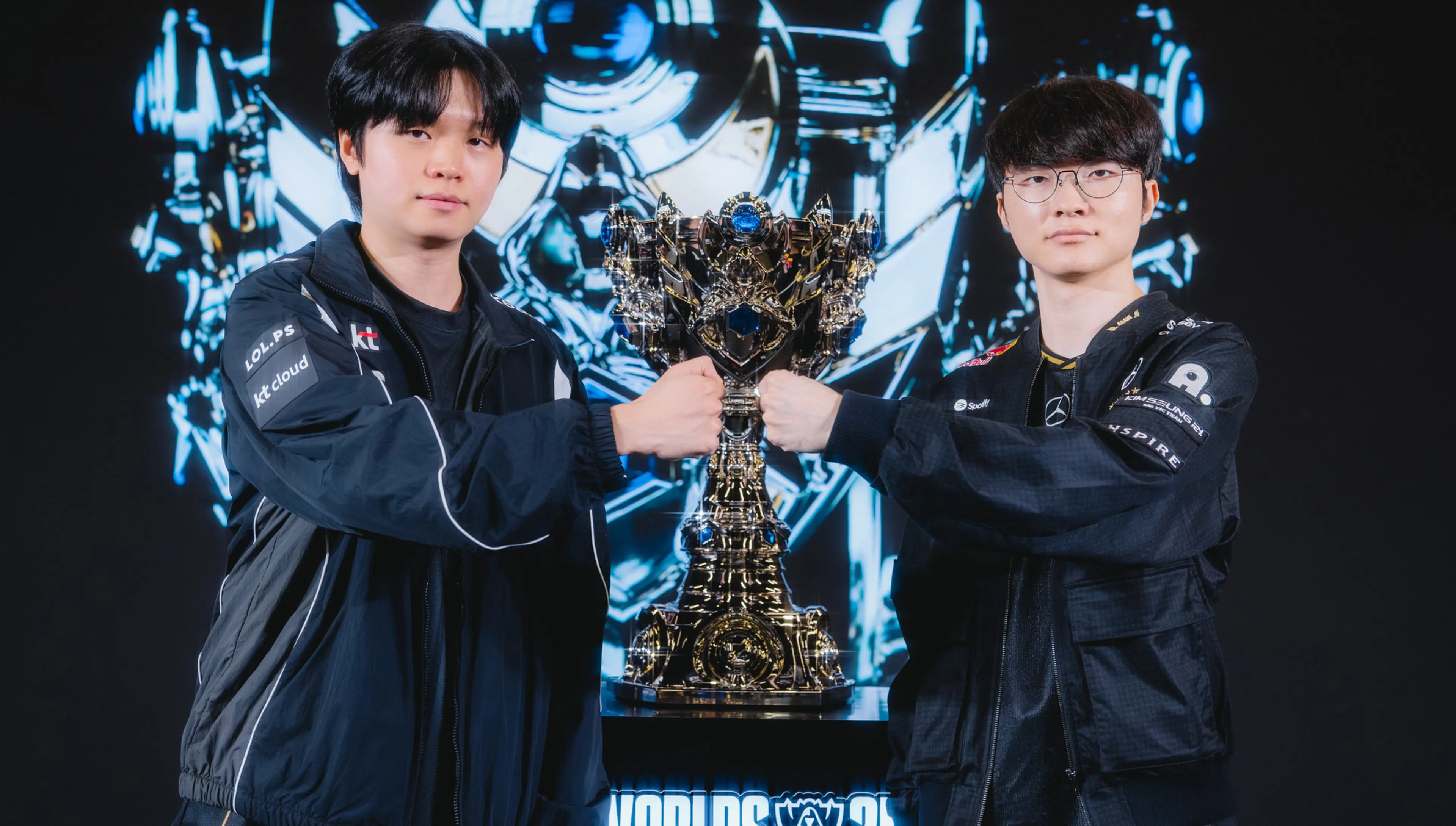 KT Rolster Bdd and T1 Faker fist bumping next to the Worlds 2025 Trophy